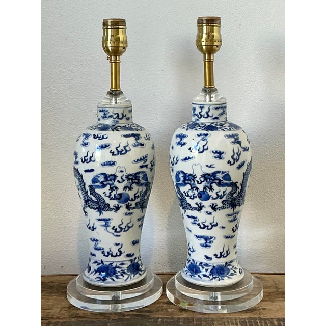 This elegant pair of vintage Chinoiserie table lamps captures the timeless allure of traditional blue and white pottery....