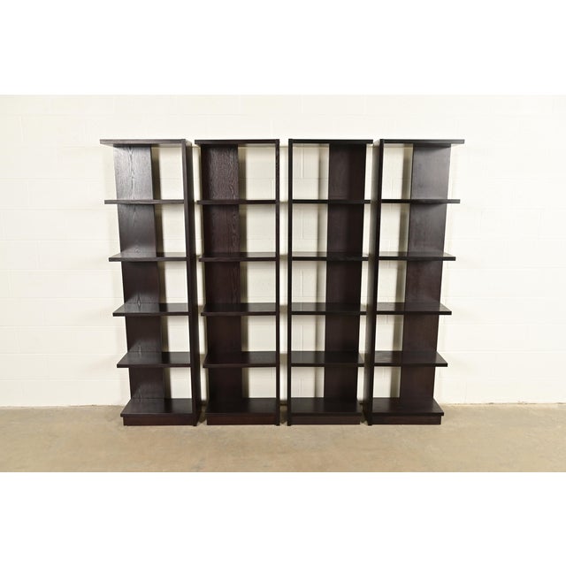 A gorgeous set of four Modern Art Deco style dark oak modular bookshelves, étagères, or display units In the manner of...