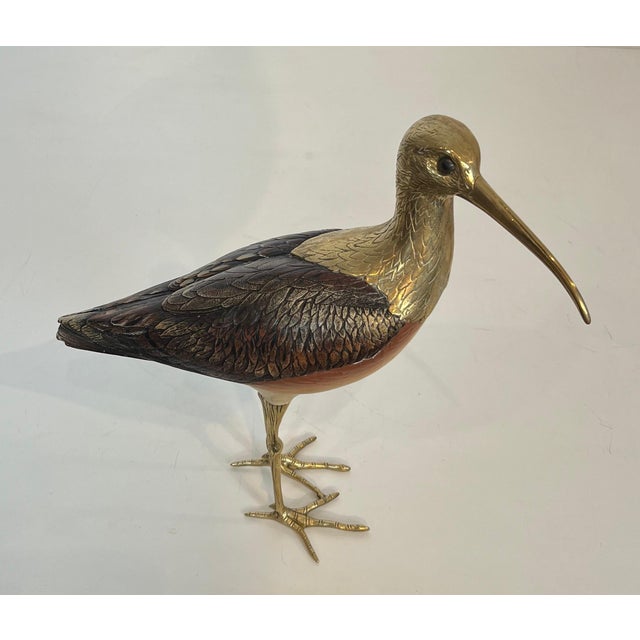 This beautiful and delicate sculpture of a bird is made of polychrome wood and chiseled brass. It is an Italian work,...