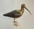 This beautiful and delicate sculpture of a bird is made of polychrome wood and chiseled brass. It is an Italian work,...