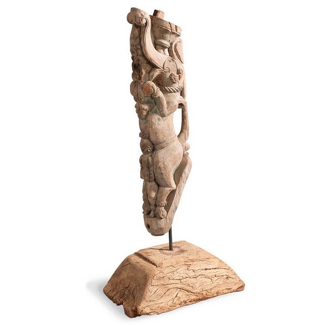 A striking hand-carved wooden Yali from South India, mid to late 20th century. This temple fragment showcases masterful...