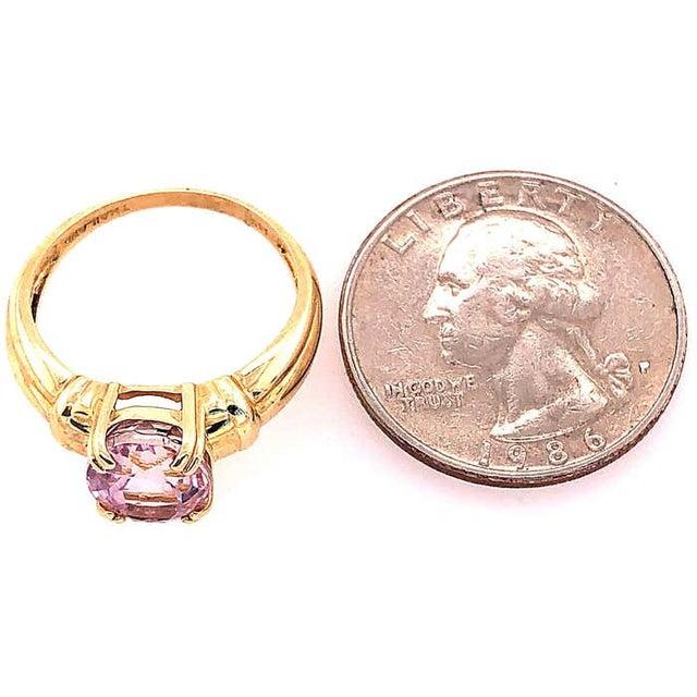 14 Karat Yellow Gold Fashion Oval Amethyst Ring Size 8. 10.00 mm x 8.00 mm amethyst 3.65 grams total weight.