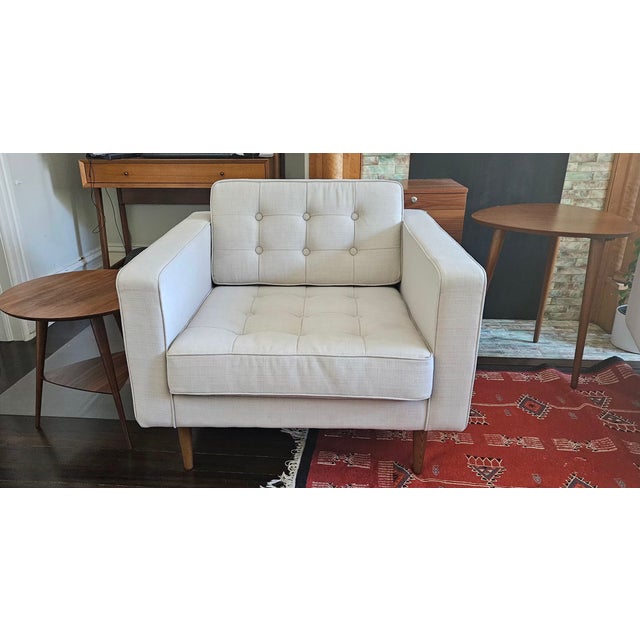 Beautiful matching pair of MXM Design upholstered lounge chairs in a versatile light beige/cream fabric. These chairs...
