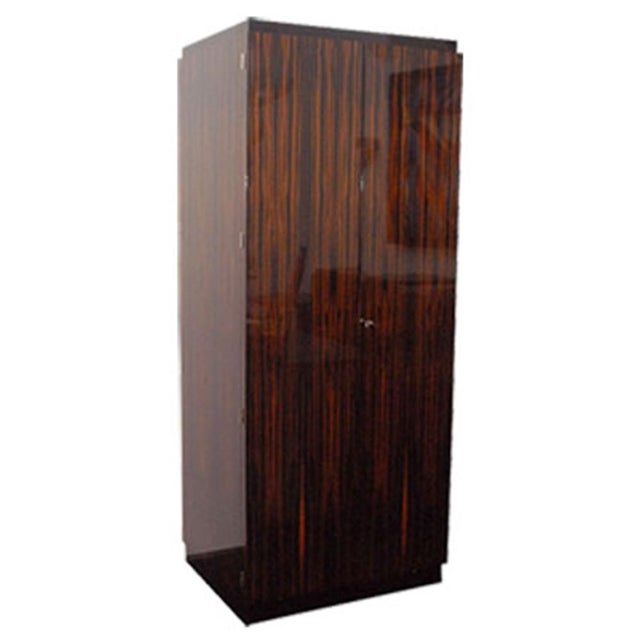 Tall Frame, Macassar Doors and Sides, Black Lacquer Base, Top Platform with interior shelves and optional TV pull-out tray.