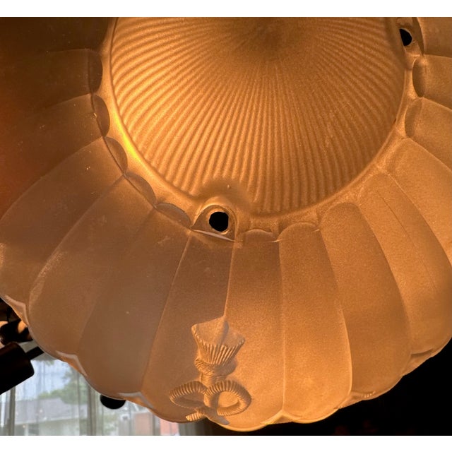 A sculptural vintage ceiling shade with elegant fluting and a subtle nautical motif—perfect for coastal and classic...