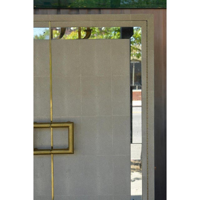 Shagreen bar cabinet, with an Vintage mirror frame on the front as well as both sides. 2 inch thick Lucite base.