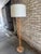Vintage Danish floor lamp, light wood. This Mid-Century style oak floor lamp features a turned wood column on a round...