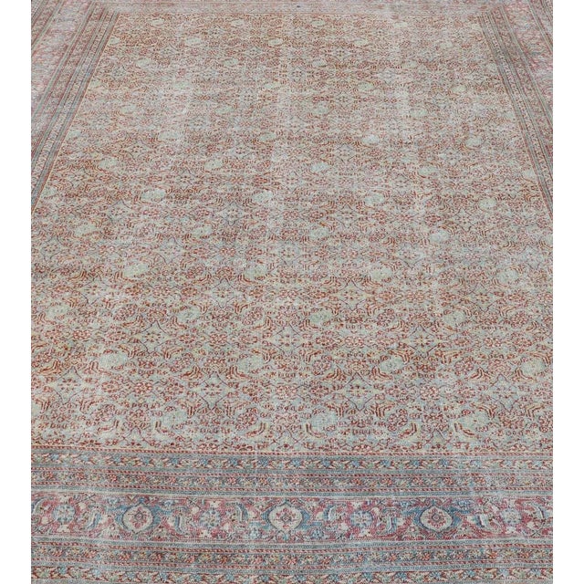 Antique Persian Khorassan rug with all-over floral design in red and blue. Country of Origin: Iran Type: Khorasan Design:...