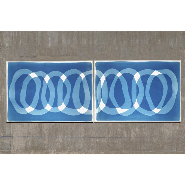 “The Blue Necklace” is a handmade unique cyanotype monotype that reimagines precious jewelry through a minimalist,...