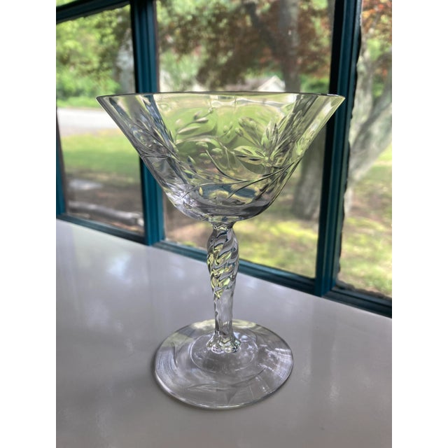 Vintage set of 2 Floral etched crystal champagne glasses 5"H X 4" D , No makers mark, in excellent condition.