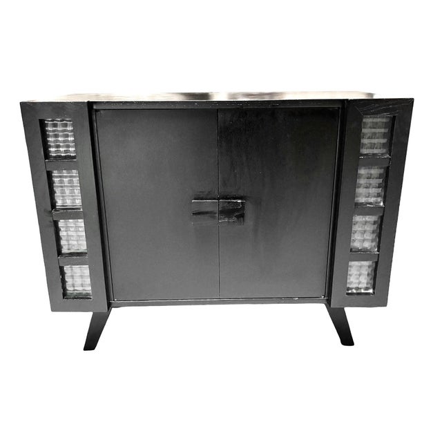 This stylish Mid-century Bar cabinet featuring a large 2-tier center cabinet for glasses and bar-ware with 4 pull out...