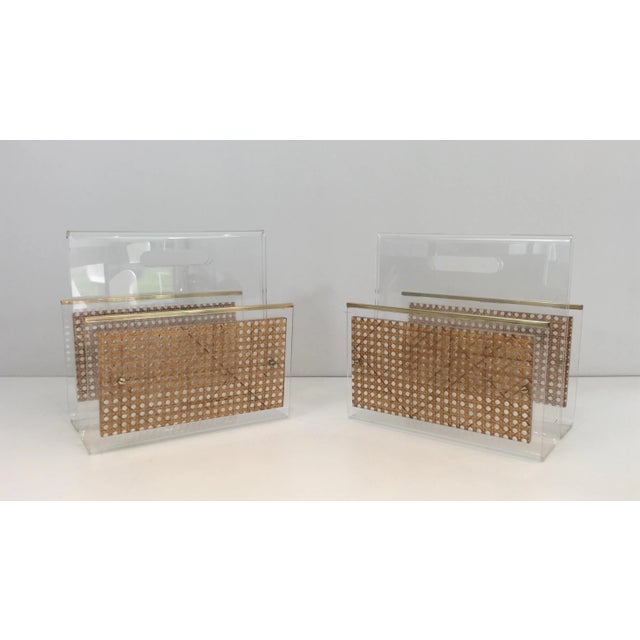 This very nice pair of magazine racks are made of Lucite and encrusted cane. This is a beautiful work in the style of...
