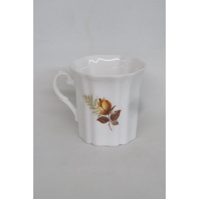 This lovely Tea / Coffee Cup is made of fine bone china. This darling collectible teacup is stamped on the bottom as...