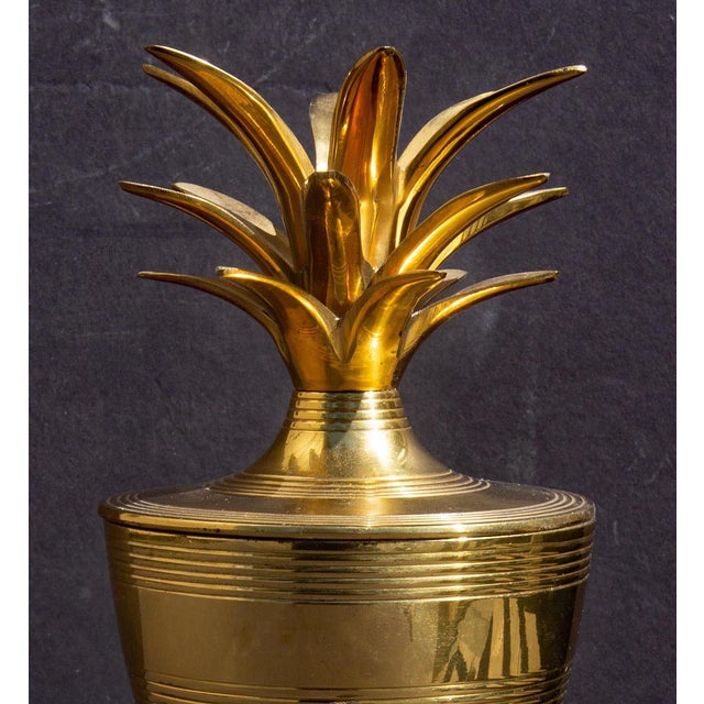 Solid brass pineapple covered urn. Warm gold color.