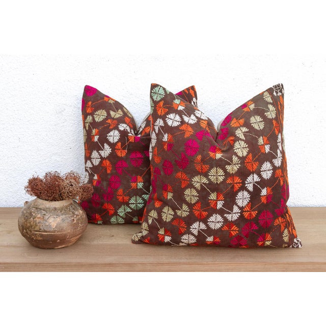 This curated set of two 18-inch square pillows offers a rare opportunity for symmetry, handcrafted from the same Antique...