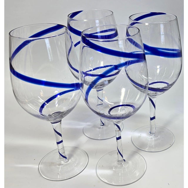 A set of four cobalt carnivals in a glass are looking for a new home. A whirling, twirling ribbon of Cobalt unfurls from...