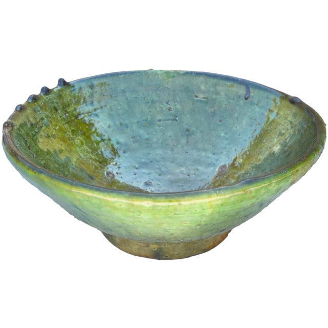 Antique handcrafted and glazed Moroccan ceramic bowl with vibrant green color variation and ornate details. This beautiful...