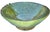 Antique handcrafted and glazed Moroccan ceramic bowl with vibrant green color variation and ornate details. This beautiful...