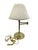 Brass plated swing arm lamp with lampshade Swing arm table lamp that moves with ease. The lampshade needs to be replaced...