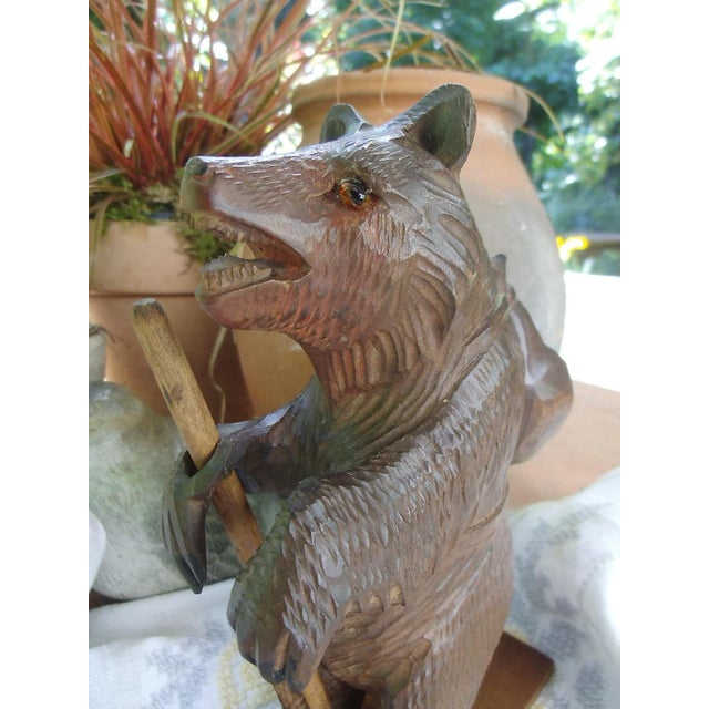 A wonderfully quirky wooden bear from the Black Forest, with skis and backpack, hand-carved and rare. One eye is missing;...