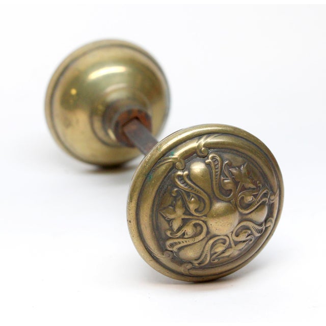 These Art Nouveau three fold door knobs were made by Reading in the 1905 catalog. It is part of the G-11600 Crofton group....
