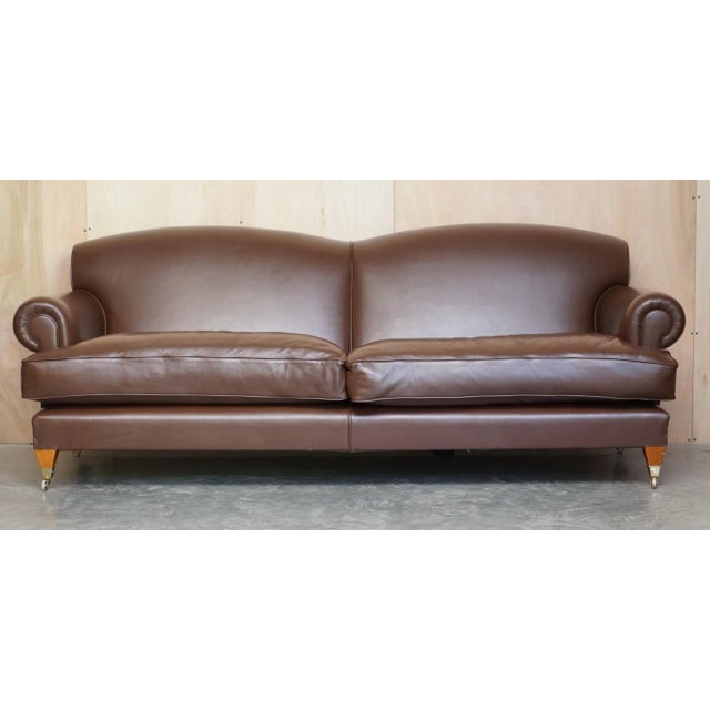 We are delighted to offer for sale this lovely, contemporary, solid brown colour Howard & Son’s style three seat sofa with...