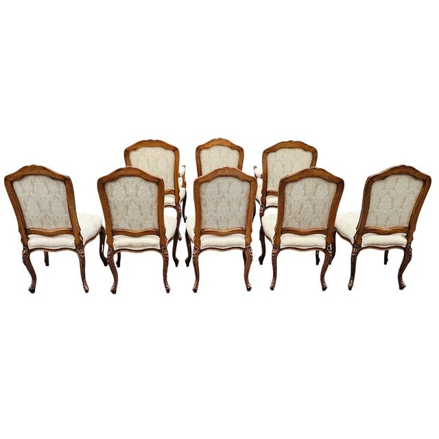 This Vintage Set of 8 Carved Custom Louis XV Style Dining Chairs has the presence distinguished enough for a cultivated...