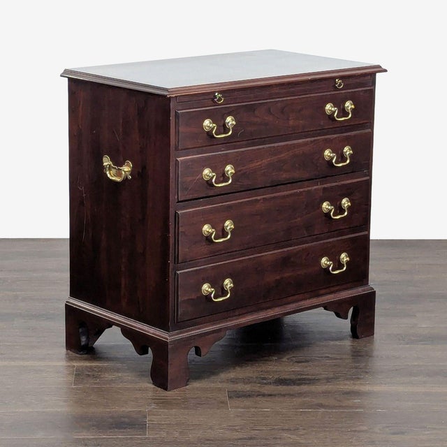 Chippendale style bachelor's chest with brass embellishments. Brand: Stickley. Dimensions (in): 32W x 18D x 31H.