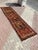 This gorgeous hand knotted vintage Anatolian runner rug is approximately 70 years old in excellent vintage condition. The...