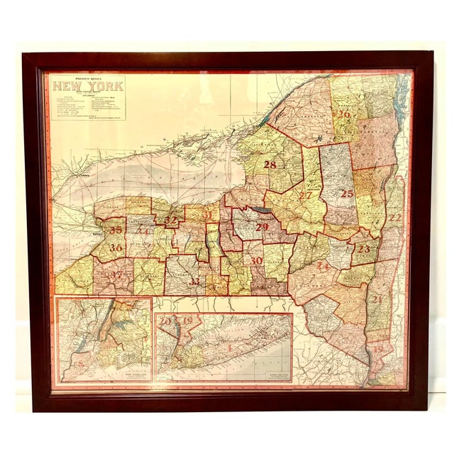 Colored map of New York state, published in Chicago in 1907 by The Geographical Publishing Co. Framed in mahogany wood.