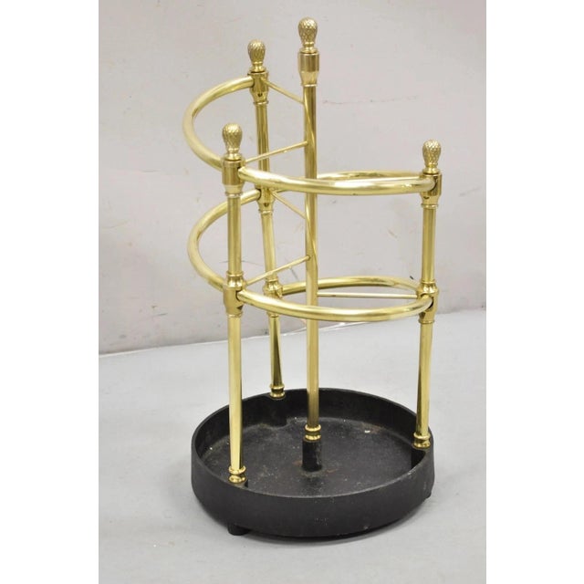 Sarreid Ltd. Victorian Style Polished Brass & Cast Iron Spiral Umbrella Cane Stand. Circa Late 20th Century. Measurements:...