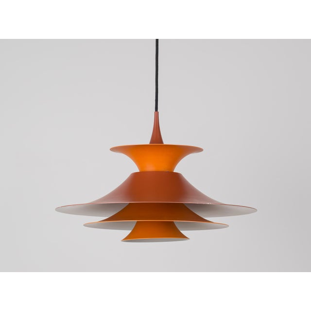 The Radius pendant lamp was designed in 1977 by Danish designer Erik Balslev for the renowned Danish lighting manufacturer...