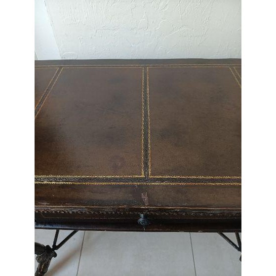 Vintage console writing desk featuring ornate cast metal winged female caryjated legs and dark leather top Style:...