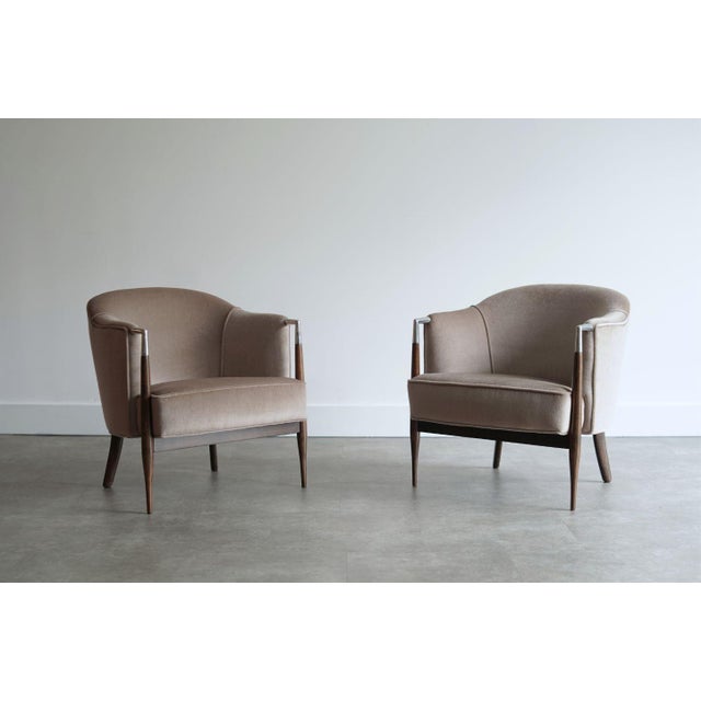 Set of vintage lounge chairs, original from the 1960s, fully restored by Stamford Modern. These striking chairs feature...