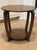 Sculptural American Art Deco occasional table dating to the 1930s, crafted in richly grained quarter-sawn oak with a...