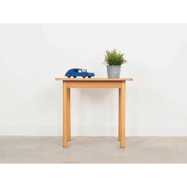 The coffee table was made in the 1970s, Danish production. The legs are made of solid wood. The table top is covered with...