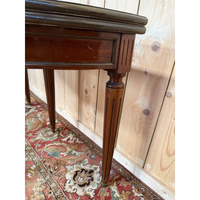 A louis xvi style half-moon console table in solid mahogany, faithful to the aesthetic codes of the 18th and 19th...