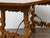 A Baroque style walnut Fratino table from the 18th century with wrought-iron stretchers. A striking example of Spanish...