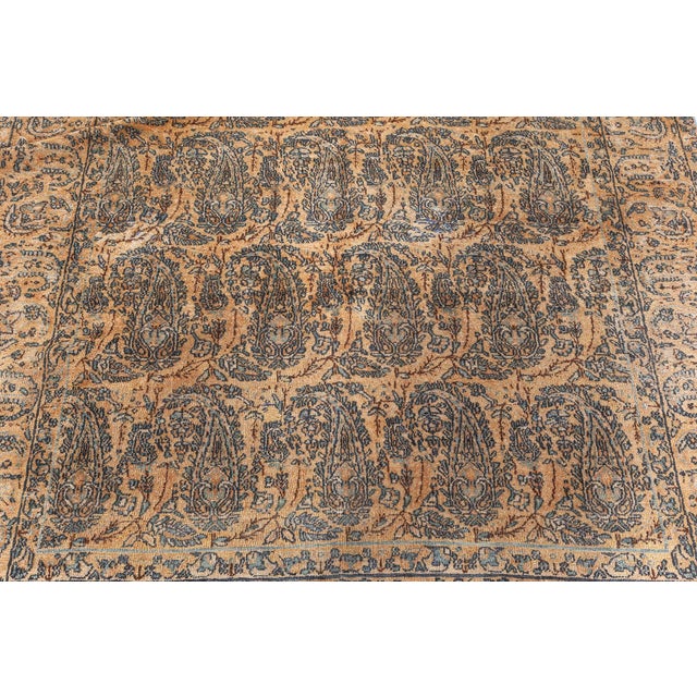 A late 19th century Persian Tabriz antique rug, the honey field with an allover design of staggered enlarged botehs...