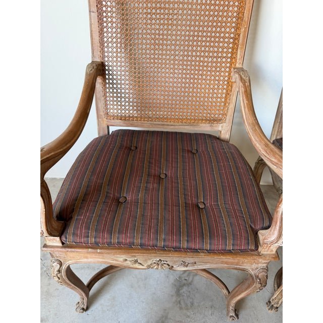 Vintage Hollywood Regency Louis XV-Style Carved Wood & Cane Armchairs – A Pair For Sale - Image 9 of 13