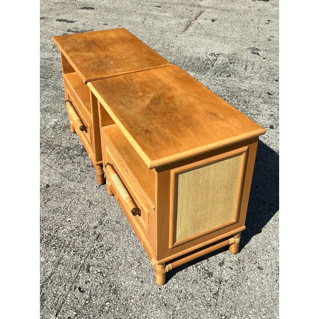 Embrace timeless coastal charm with this beautifully crafted pair of vintage rattan-trimmed nightstands. Designed with a...