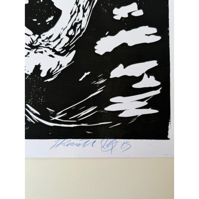 Black-and-white linocut by Hans Krull, dated 2009, depicting an expressive face. Signed and numbered 10/100. Unframed....