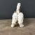 Lively handcrafted Shiwan pottery dog figurine, a classic piece of Chinese folk ceramic art. Captured in a playful...