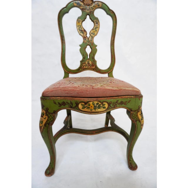 Late 19th Century Green Painted Chair With Needlepoint Seat A green-painted chair with floral motifs and scrollwork....