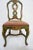Late 19th Century Green Painted Chair With Needlepoint Seat A green-painted chair with floral motifs and scrollwork....