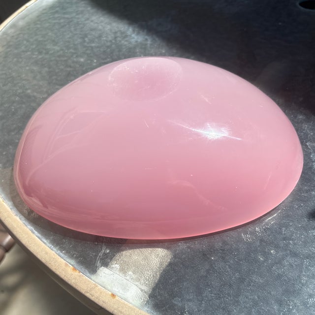 The soft, milky opalescence transitioning into a deep pink hue is characteristic of Venetian opaline or alabastro glass...