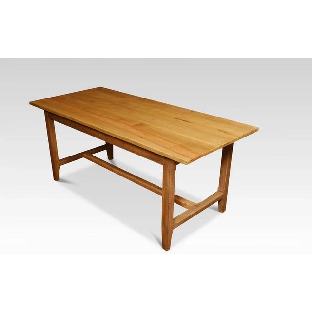 Large kitchen dining refectory table, the large rectangular top above a shallow frieze fitted with two drawers. All raised...