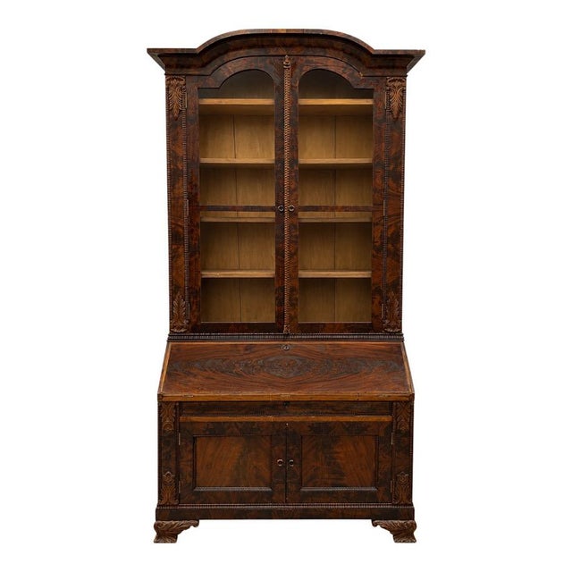 This is a late 19th century flame mahogany secretary bookcase. The secondary wood is pine. It is American. The piece is...