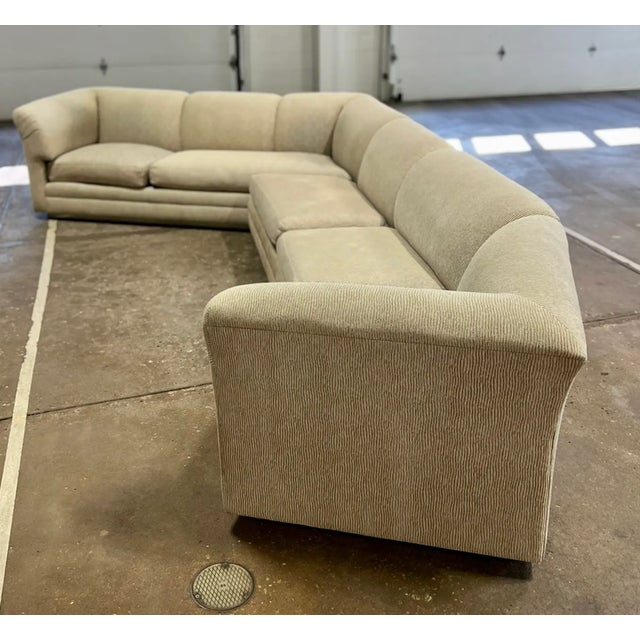 Large vintage mid century era 3 piece sectional sofa. It has a recessed chrome paneled base. This is a very solidly built...