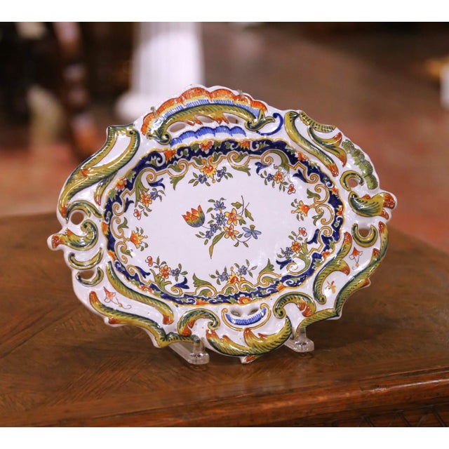 Decorate a kitchen wall with this colorful antique French faience platter. Crafted in Rouen circa 1920, the large oval...